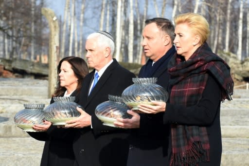 US Vice President Mike Pence (2nd L) passed through the Auschwitz camp's infamous "Arbeit macht frei" ("Work makes you free") gate before laying a wreath at the death wall where the Nazis executed thousands of people
