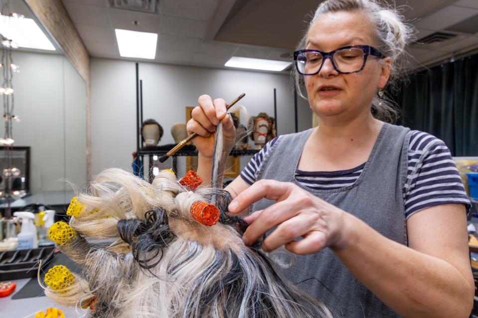 Joanne Middleton-Weaver works on wigs during a Nov. 16 rehearsal for Lyric Theatre's new million-dollar production of "A Christmas Carol" in Oklahoma City.