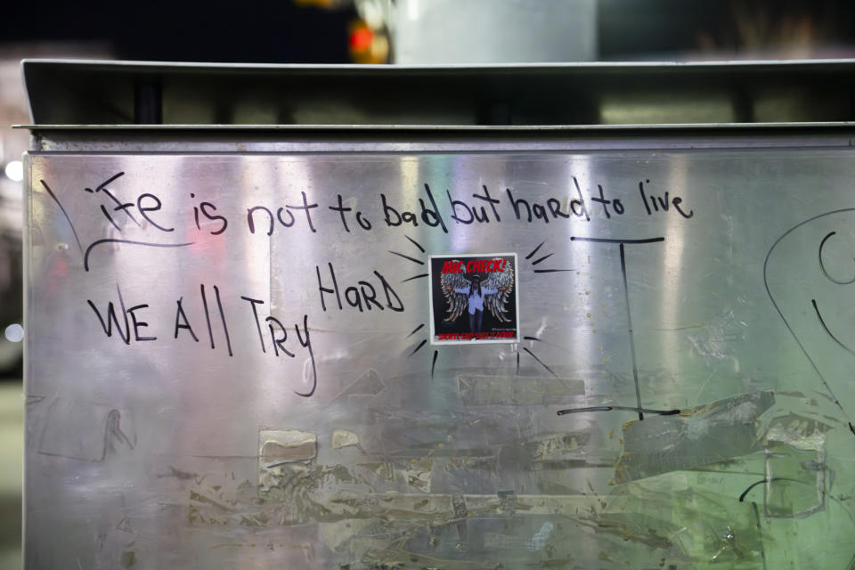 Graffiti near city hall reads "Life is not too bad but hard to live. We all try" during a vigil for the homicide victims of 2023 on Wednesday, Jan. 3, 2023 in Baltimore. Mayor Brandon Scott hosted the vigil. (Kaitlin Newman/The Baltimore Banner via AP)