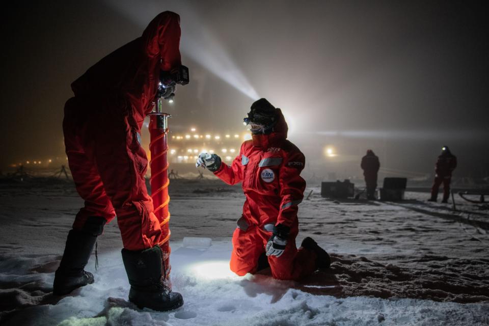 Scientific teams drill into the ice to extract core samples on the afternoon of Dec. 15, 2019. (Photo: Esther Horvath)