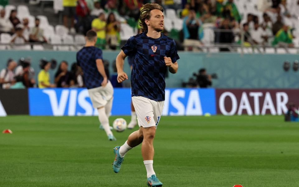  Luka Modric warms up ahead of the Qatar 2022 World Cup quarter-final football match between Croatia and Brazil at Education City Stadium - Jack Guez/Getty Images