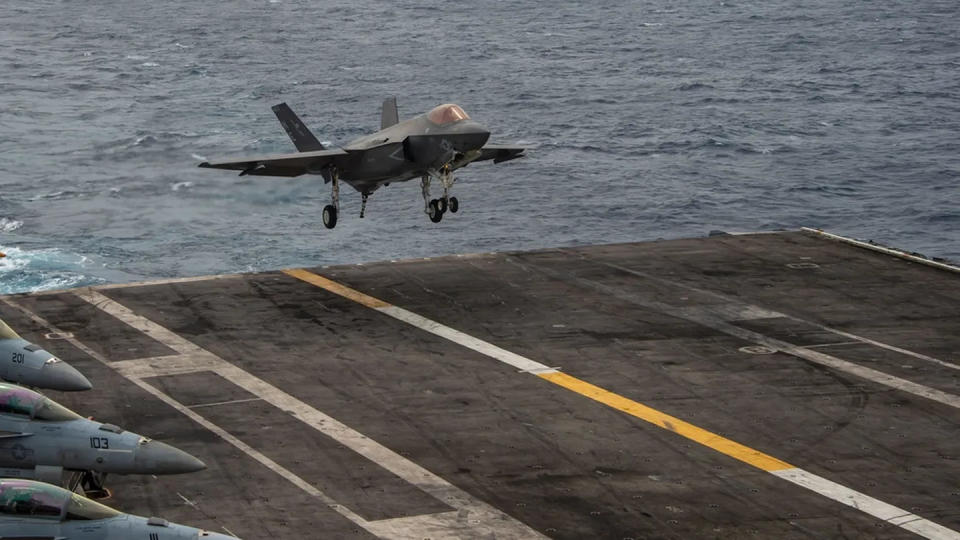 A F-35C Lightning II fighter jet comes in for a landing aboard the aircraft carrier Carl Vinson in January 2022. (Navy)