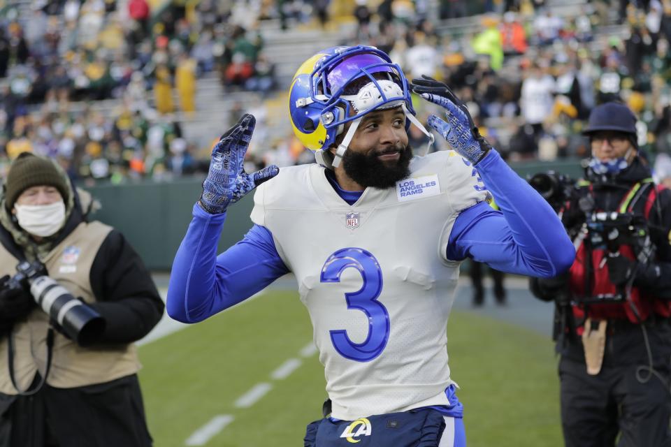 Los Angeles Rams' Odell Beckham Jr. takes the field to warm up before an NFL football game against the Green Bay Packers Sunday, Nov. 28, 2021, in Green Bay, Wis. (AP Photo/Aaron Gash)