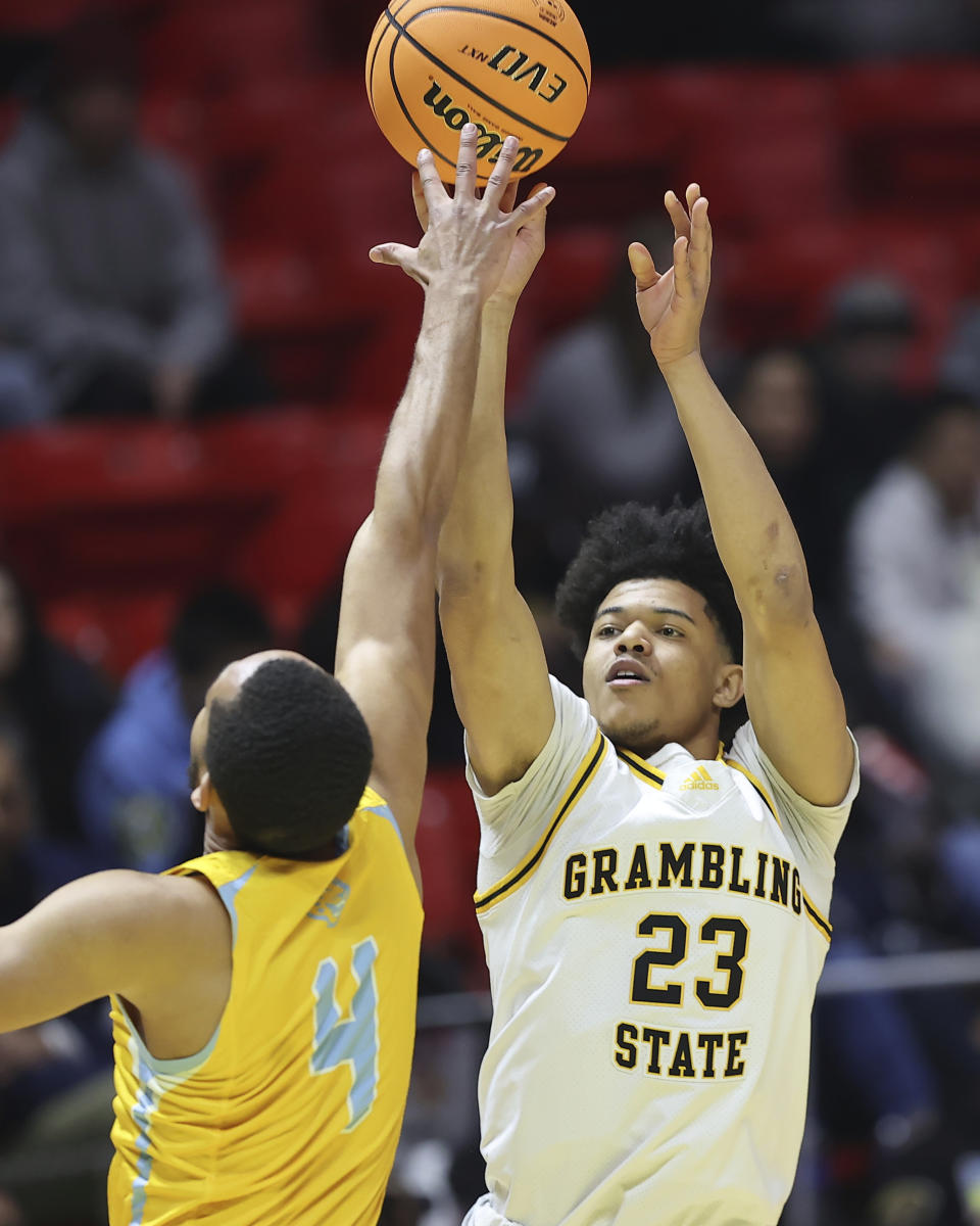 Grambling State guard Quintin Murrell (23) shoots over Southern guard Isaiah Rollins (4) during the NBA All-Star HBCU classic college basketball game Saturday, Feb. 18, 2023, in Salt Lake City. (AP Photo/Rob Gray)