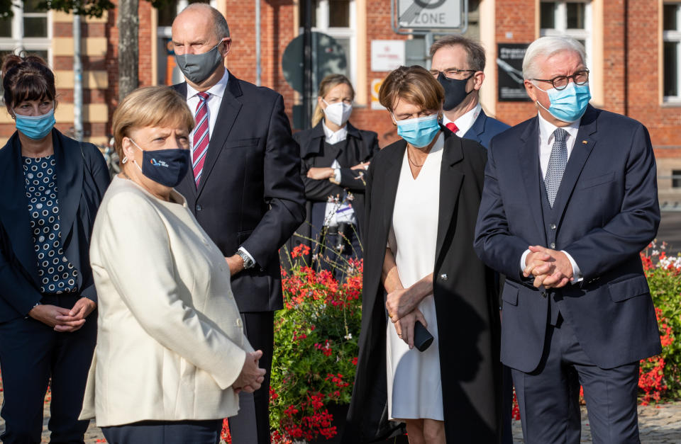 BERLIN, GERMANY - OCTOBER 03: German President Frank-Walter Steinmeier, arrives with his wife Elke Buendenbender, German Chancellor Angela Merkel and Dietmar Woidke, President of the Federal Council, with his wife Susanne Woidke during an Ecumenical church service to mark the 30th anniversary of German reunification on October 03, 2020 in Potsdam, Germany. On October 3, 1990, following the fall of the Berlin Wall and the end of the Cold War a year earlier, West Germany and East Germany merged into modern Germany. (Photo by Andreas Gora - Pool/Getty Images)