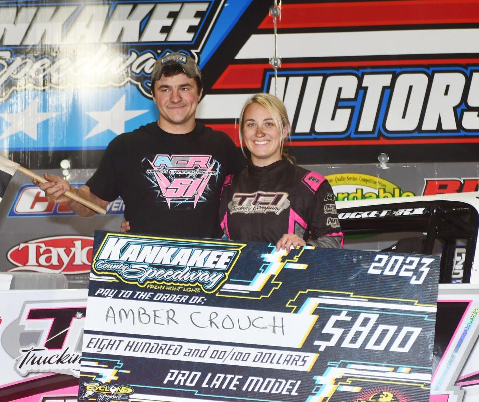 Amber Crouch, right, of Cullom earned her first-ever pro late model feature win last week at Kankakee County Speedway. Her brother, Timmy Crouch, sets up and maintains the speedster.