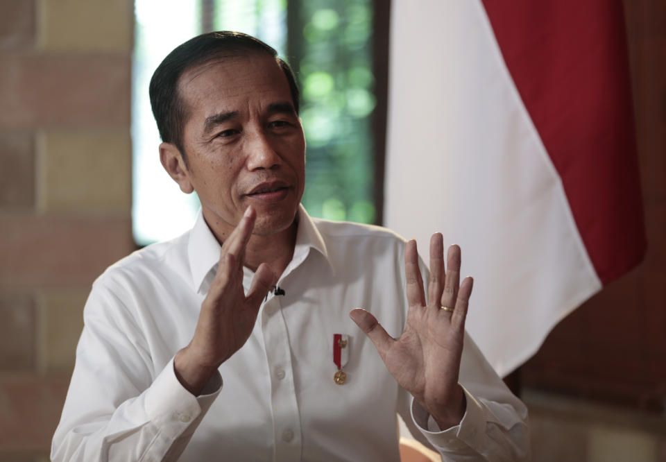 Indonesian President Joko Widodo gestures during an interview with The Associated Press in Jakarta, Indonesia, Friday, July 26, 2019. In the wide-ranging interview, Widodo outlined his priorities for his second term, including continuing large-scale infrastructure projects and simplifying a cumbersome bureaucracy. He said labor laws will be overhauled in what will be a politically challenging decision to attract more investment and create more jobs. (AP Photo/Dita Alangkara)