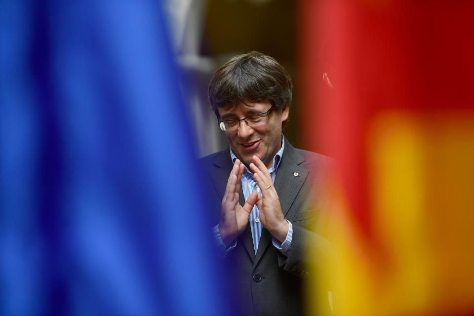 <p>Catalan president Carles Puigdemont gestures during an AFP interview in Girona on Sept. 30, 2017. The mission was entrusted to him almost by accident, but he accomplished it with determination. Deaf to the warnings of Madrid, the Catalan regional president Carles Puigdemont is determined to organize a referendum on Oct.1, 2017, hoping to fulfill his dream of youth: an independent Catalonia. (Photo: Pierre-Philippe Marcou/AFP/Getty Images) </p>