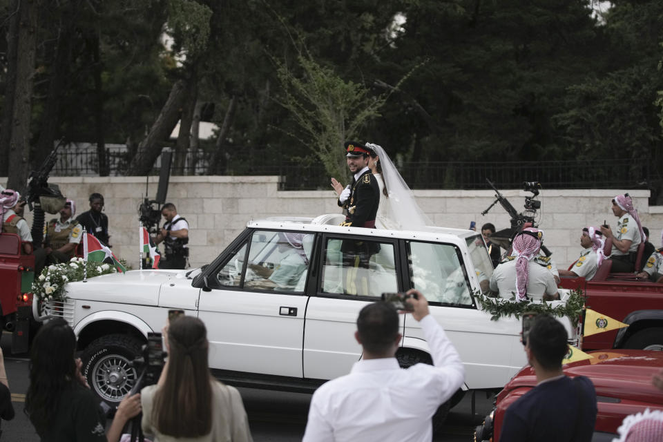 Jordan's Crown Prince Hussein and Saudi Rajwa Alseif leave Zahran Palace during their wedding ceremonies on Thursday, June 1, 2023, in Amman, Jordan. (AP Photo/Nasser Nasser)