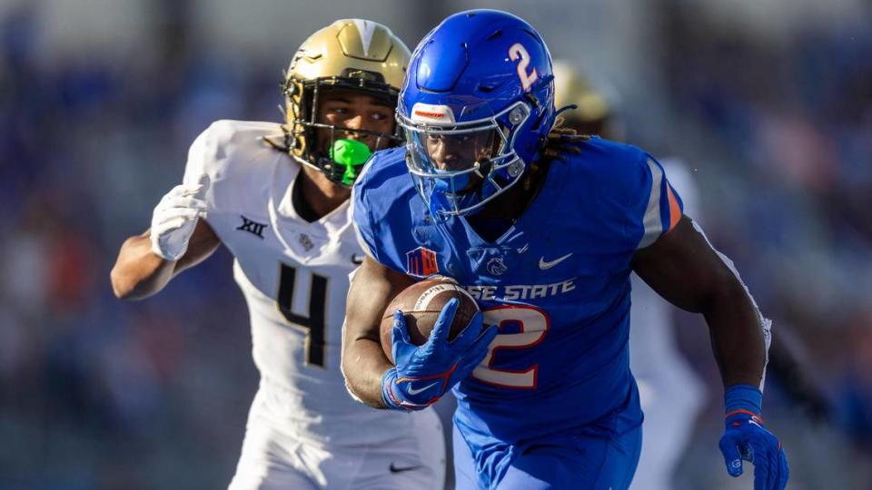 Boise State running back Ashton Jeanty runs for a touchdown with UCF defensive back Braeden Marshall in pursuit after a pass reception in the 1st quarter. It was the first score for the Broncos in their home opener, Saturday, Sept. 9, 2023.