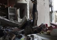 A Christmas toy lies among the damage in the besieged area of Homs December 25, 2013. REUTERS/Yazan Homsy (SYRIA - Tags: POLITICS CIVIL UNREST CONFLICT)