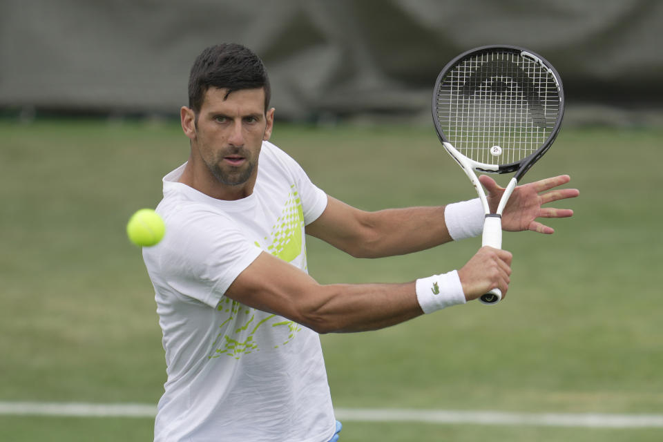 Novak Djokovic of Serbia takes part in a practice session ahead of the Wimbledon tennis championships at Wimbledon, in London, Sunday, July 2, 2023. The Wimbledon Tennis championships start on July 3. (AP Photo/Kin Cheung)