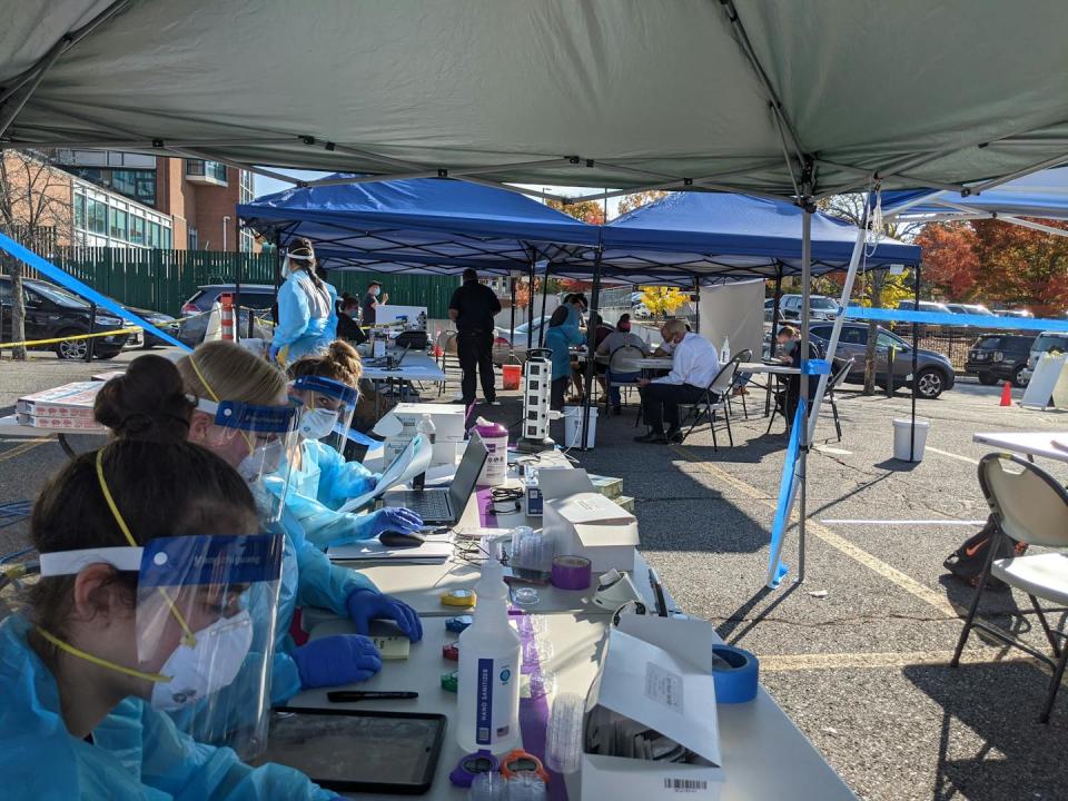 UMass Chan Medical School research staff members enroll participants in a COVID-19 testing study in Worcester, Mass., in the fall of 2020. Nathaniel Hafer