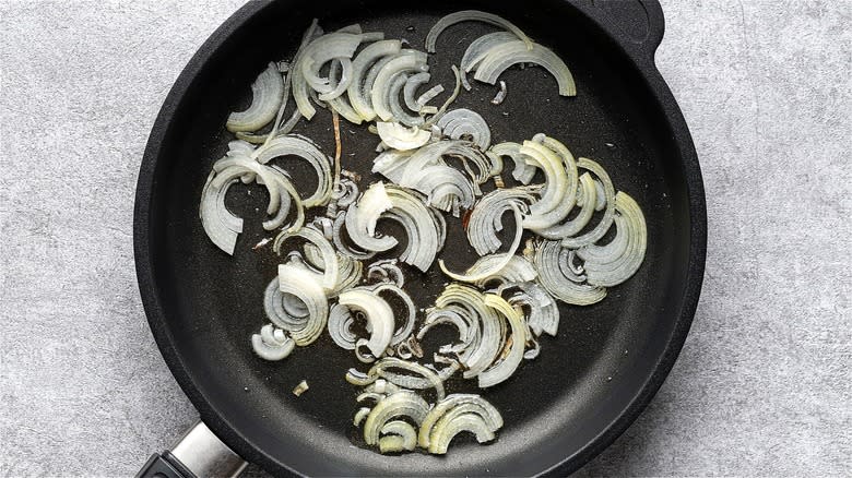 Sliced onions in skillet