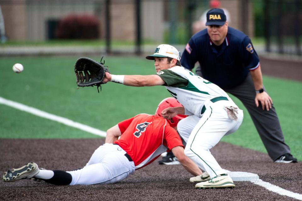Fairview's Ari Fox gets back to base safely on Thursday as the Mercyhurst Prep first baseman takes the throw on a pickoff attempt in District 10 Class 3A semifinals against Mercyhurst Prep Lakers at the Mercyhurst University baseball field. Fairview won 3-0.