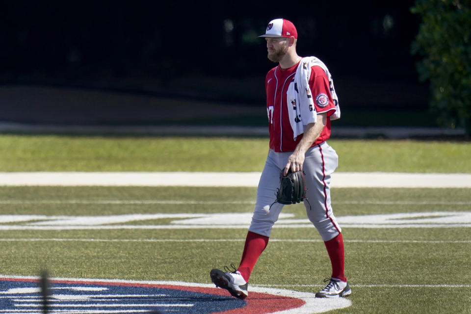 Washington Nationals pitcher Stephen Strasburg heads toward the clubhouse following spring training baseball practice Thursday, Feb. 25, 2021, in West Palm Beach, Fla. (AP Photo/Jeff Roberson)