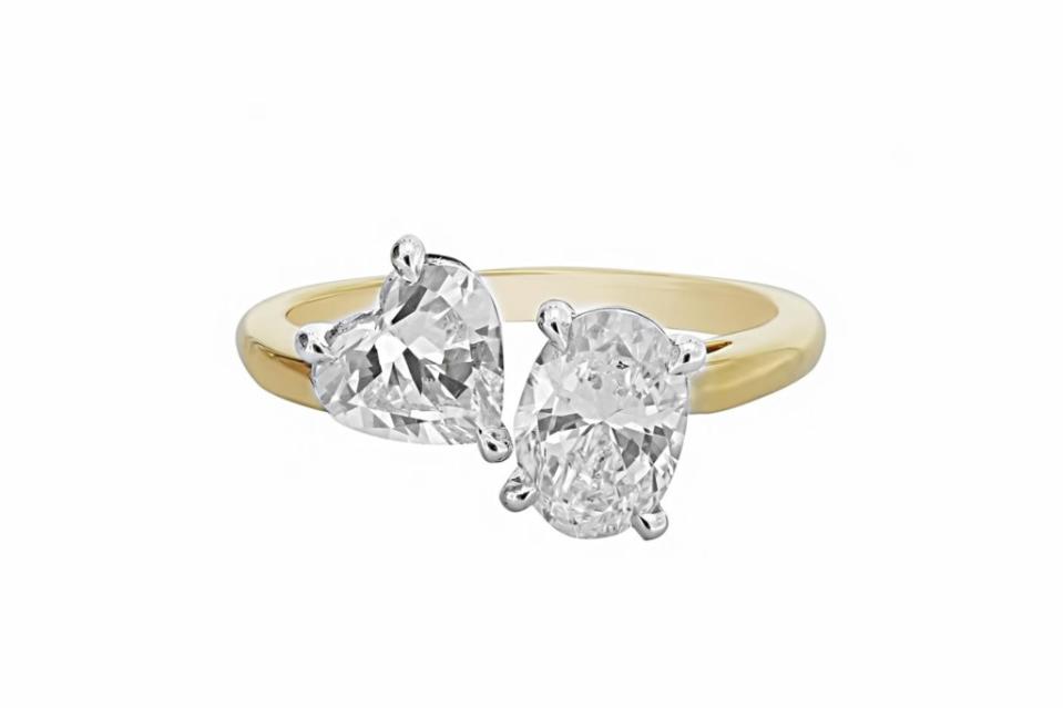 London Collection <a href="https://www.londonjewelers.com/london-collection-18k-yellow-gold-oval-and-heart-shaped-diamond-two-stone-ring" rel="nofollow noopener" target="_blank" data-ylk="slk:ring in 18-k yellow gold with diamonds;elm:context_link;itc:0;sec:content-canvas" class="link ">ring in 18-k yellow gold with diamonds</a>, $16,900 at London Jewelers