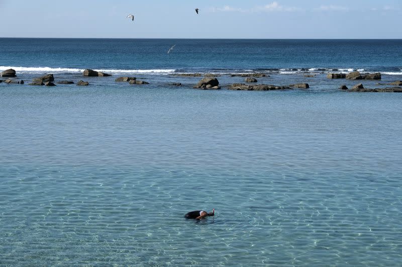 Man fishes at the sea in Benghazi