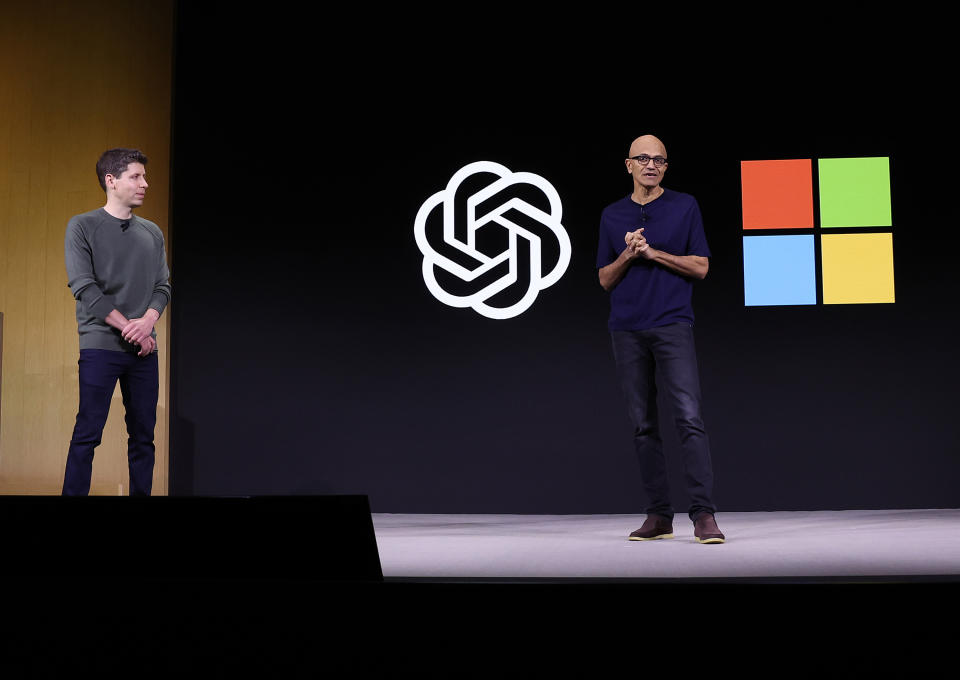 SAN FRANCISCO, CALIFORNIA - NOVEMBER 06: Microsoft CEO Satya Nadella (R) speaks as OpenAI CEO Sam Altman (L) looks on during the OpenAI DevDay event on November 06, 2023 in San Francisco, California. Altman delivered the keynote address at the first ever Open AI DevDay conference. (Photo by Justin Sullivan/Getty Images)