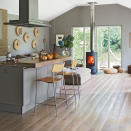 <p> Create a hybrid of styles within your kitchen scheme by combining kitchen worktops on your kitchen island. Use a different material to indicate a change of function for that portion of the kitchen island. </p> <p> In this stylish kitchen space a hearty wooden worktop is extended out – over the granite worktop covering the remainder of the island – to form a dedicated dining area. Simple placement with bar stools helps to enhance the signals for its dining function. </p>