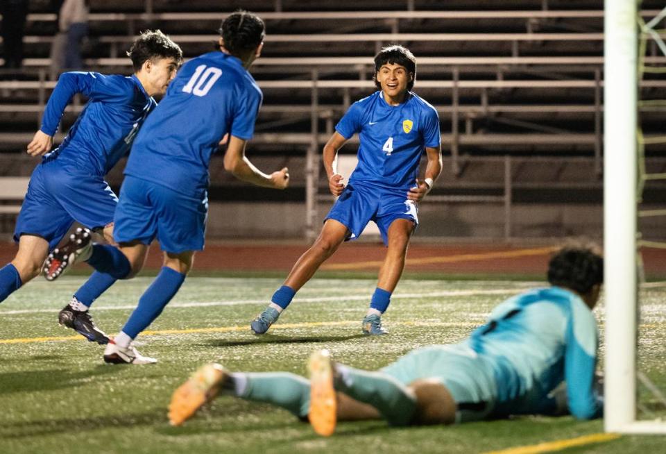 Turlock players celebrate the goal by Sebastian Carbajal (10) during the Central California Athletic League game with Enochs at Turlock High School in Turlock, Calif., Wednesday, Jan. 24, 2024. Turlock won the game 2-1.