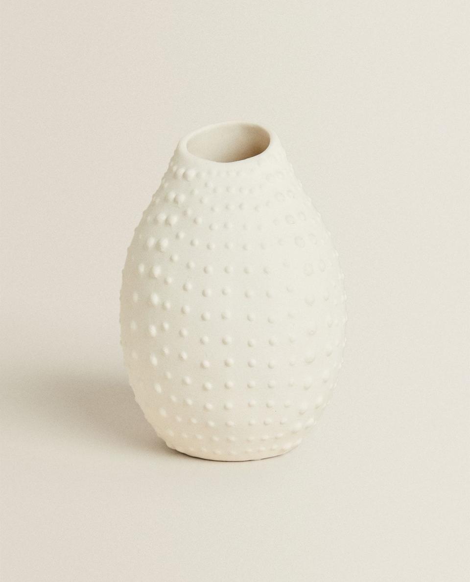 <p>zarahome.com</p><p><strong>$19.90</strong></p><p><a href="https://www.zarahome.com/us/living-room/vases/textured-vase-c1020264606p302069592.html?colorId=250&ct=true" rel="nofollow noopener" target="_blank" data-ylk="slk:Shop Now;elm:context_link;itc:0;sec:content-canvas" class="link ">Shop Now</a></p><p>For a minimal approach, try a monochrome hobnail vase. Its organic form reminds us of Kusama’s signature dotted pumpkins and gourds. </p>