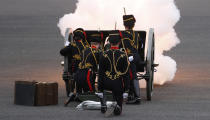 Soldiers of the Royal Horse Artillery fire a ceremonial gun during the 41 Death Gun salute in memory of Prince Philip at the Royal Artillery barracks in Woolwich, London, Saturday, April 10, 2021. Buckingham Palace officials announced Friday that Prince Philip, the husband of Queen Elizabeth II, has died . He was 99. (AP Photo/Alastair Grant, Pool)