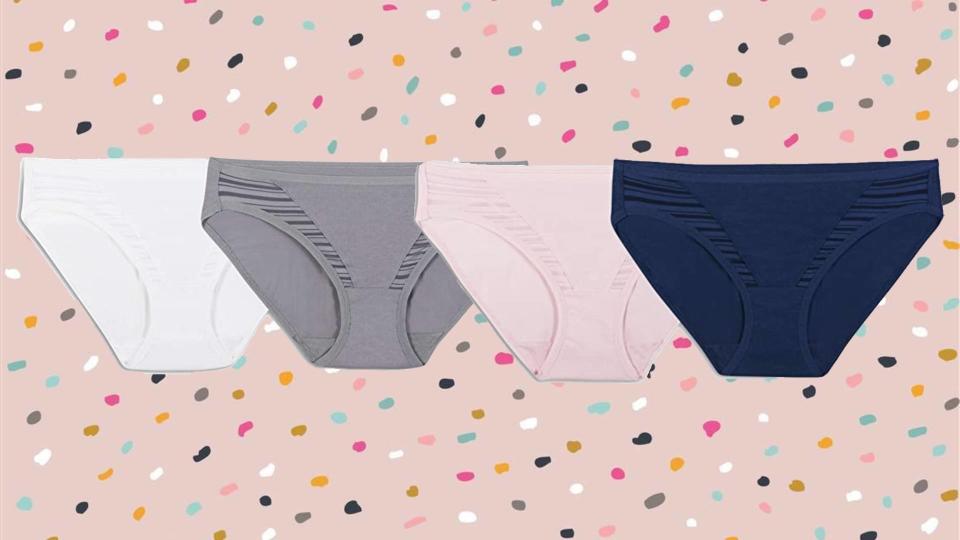 Set of four pairs of underwear in white, grey, pink and blue.