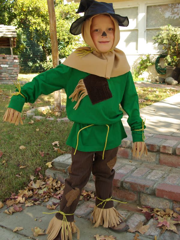 <p>This awesome costume is so easy because it starts with a green long-sleeved tee! Fleece fabric stands in for itchy straw. Add some patches and an inexpensive hat, and you're all set for the cutest trip to Oz ever. </p><p><strong>Get the tutorial at</strong> <strong><a href="http://oleanderandpalm.com/2012/10/halloween-costumes-wizard-of-oz.html" rel="nofollow noopener" target="_blank" data-ylk="slk:Oleander and Palm;elm:context_link;itc:0;sec:content-canvas" class="link ">Oleander and Palm</a>. </strong></p><p><a class="link " href="https://www.amazon.com/Newcastle-Fabrics-Polar-Fleece-Fabric/dp/B01CUK7J9C/ref=sr_1_2?dchild=1&keywords=tan+fleece&qid=1592596174&sr=8-2&tag=syn-yahoo-20&ascsubtag=%5Bartid%7C10050.g.28190286%5Bsrc%7Cyahoo-us" rel="nofollow noopener" target="_blank" data-ylk="slk:SHOP TAN FLEECE;elm:context_link;itc:0;sec:content-canvas">SHOP TAN FLEECE</a></p>