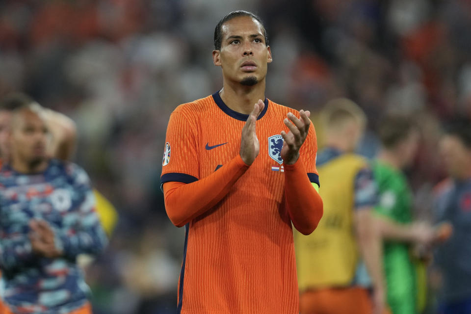 Netherlands' Virgil van Dijk applauds fans after a semifinal match between the Netherlands and England at the Euro 2024 soccer tournament in Dortmund, Germany, Wednesday, July 10, 2024. (AP Photo/Darko Vojinovic)