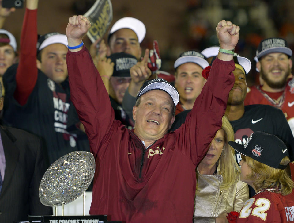 Florida State head coach Jimbo Fisher reacts with The Coaches' Trophy after the NCAA BCS National Championship college football game against Auburn Monday, Jan. 6, 2014, in Pasadena, Calif. Florida State won 34-31 (AP Photo/Mark J. Terrill)