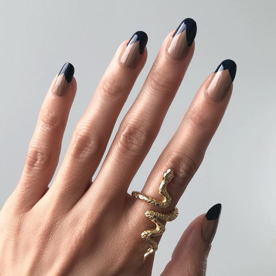 <em>Allure</em> editor-in-chief Michelle Lee is always sharing her innovative manicures, and this one with curtain-shaped tips is a chic combination of dark and neutral shades that looks incredible on longer nails.