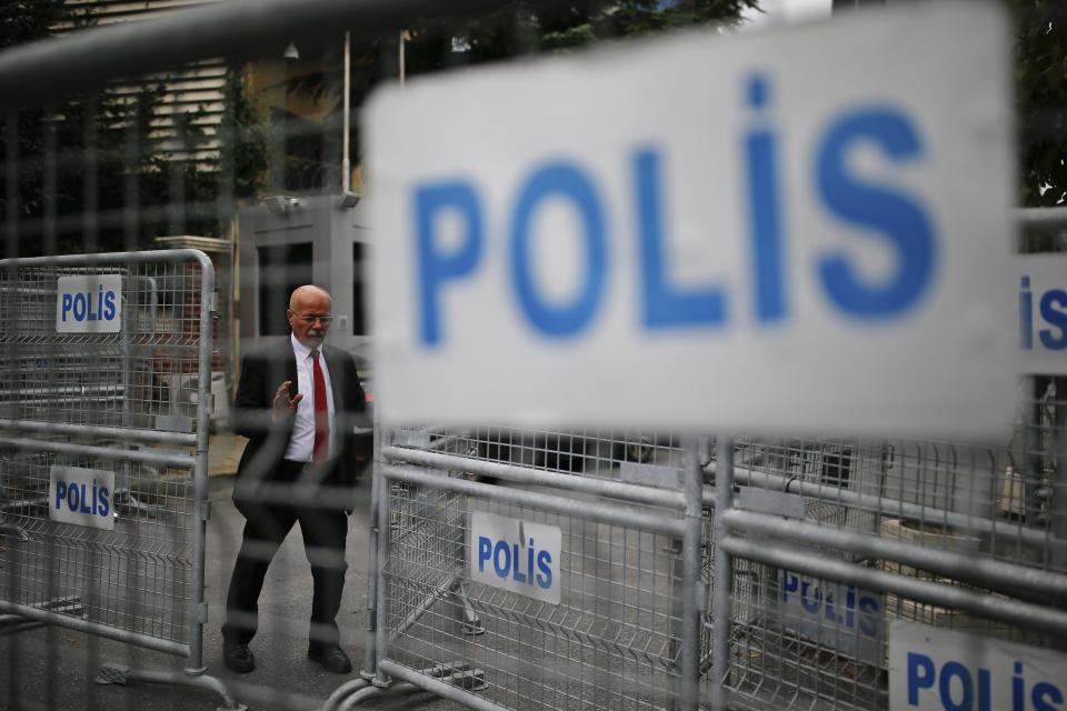 A security guard walks behind barriers blocking the road leading to the Saudi Arabia consulate in Istanbul, Thursday, Oct. 4, 2018. Saudi Arabia's Consulate in Istanbul insisted Thursday that Jamal Khashoggi, a missing Saudi contributor to The Washington Post, left its building before disappearing, directly contradicting Turkish officials who say they believe the writer is still inside. (AP Photo/Emrah Gurel)