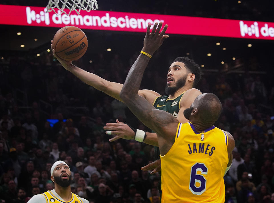 Boston Celtics forward Jayson Tatum and Los Angeles Lakers forward LeBron James will highlight the Christmas Day slate with a renewed rivalry. (Photo by Barry Chin/The Boston Globe via Getty Images)