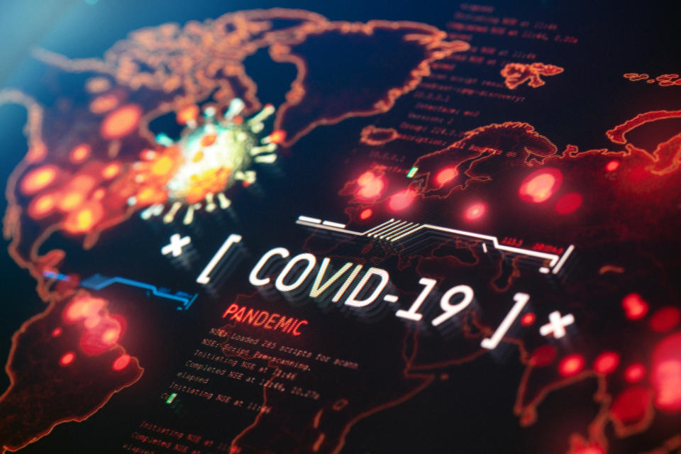 COVID-19 Pandemic on a World Map Background