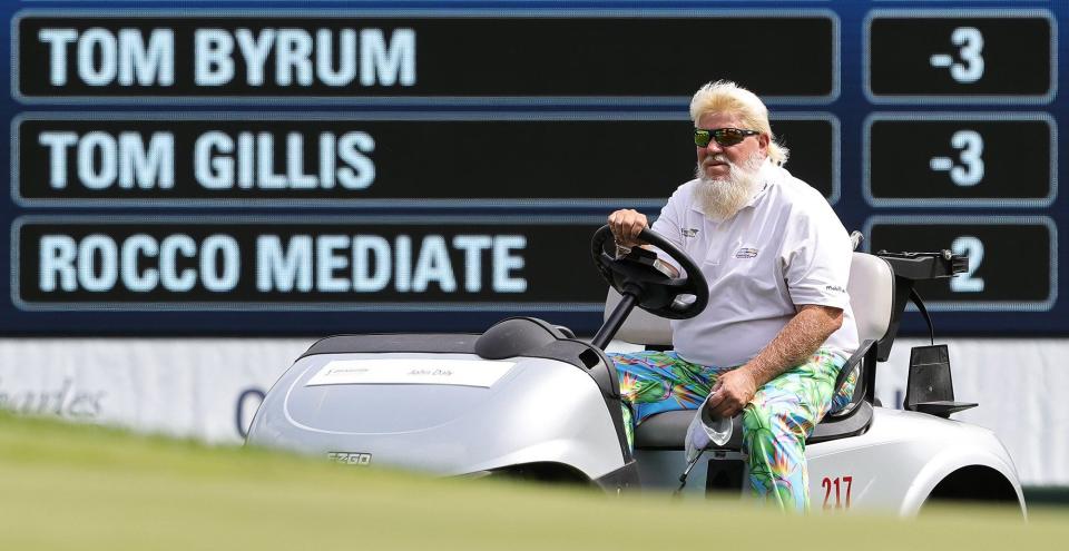 John Daly cruises up the fairway to the 9th hole during first round of the Bridgestone Senior Players Tournament at Firestone Country Club, Thursday, July 7, 2022, in Akron, Ohio. [Jeff Lange/Beacon Journal]