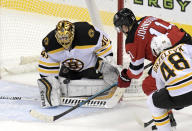 Boston Bruins goaltender Tuukka Rask (40) stops a shot by New Jersey Devils left wing Andreas Johnsson (11) during the second period of an NHL hockey game Thursday, Jan. 14, 2021, in Newark, N.J. (AP Photo/Bill Kostroun)