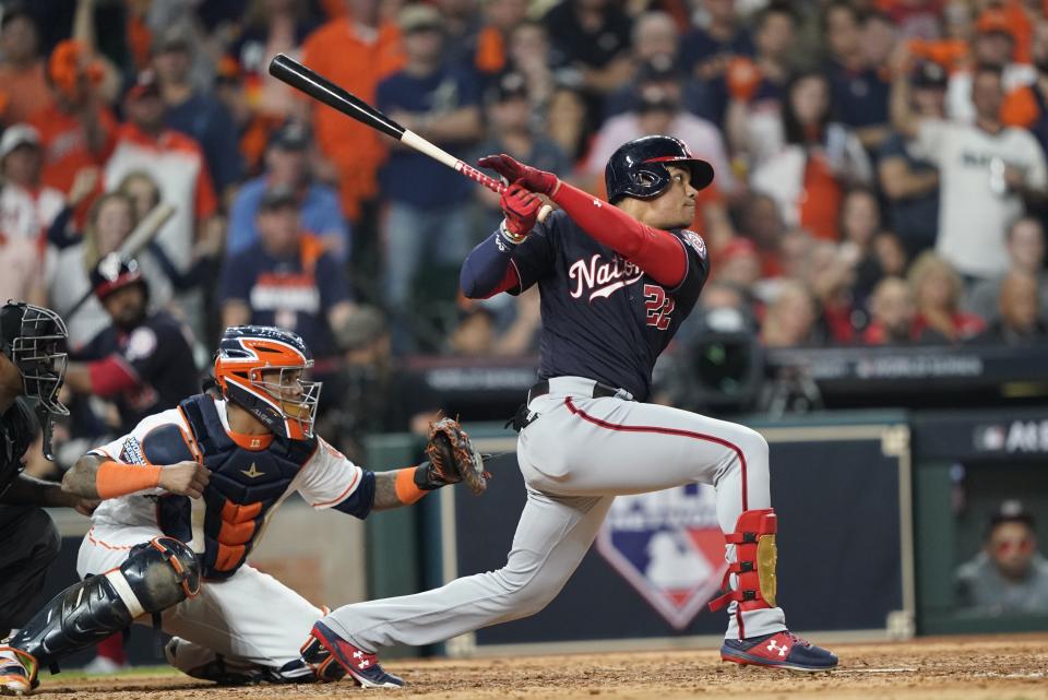 Washington Nationals' Juan Soto hits a two-run scoring double during the fifth inning of Game 1 of the baseball World Series against the Houston Astros Tuesday, Oct. 22, 2019, in Houston. (AP Photo/David J. Phillip)