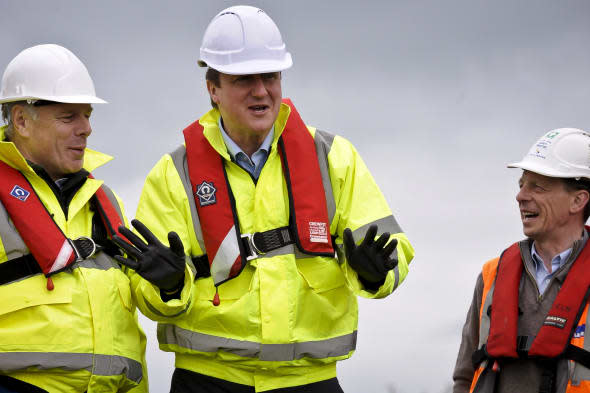 David Cameron in hi viz and safety helmet