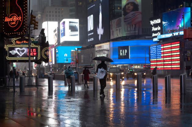 Shoppers walk through New York's Times Square on November 30, 2020.