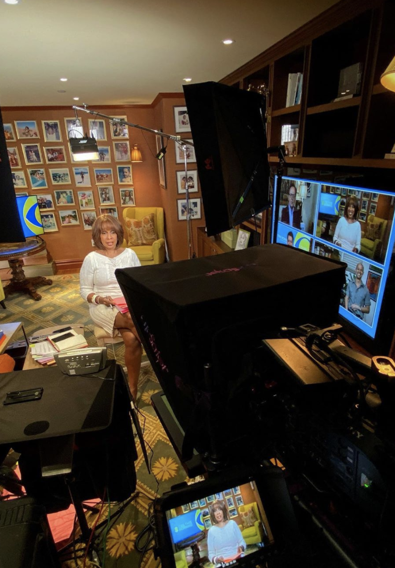Gayle King delivers the news in front of a wall of framed photos. (Photo: Instagram)