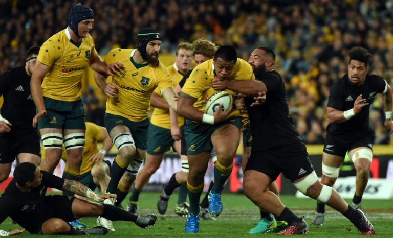 New Zealand's Charlie Faumunia (right) tackles Australia's Allan Alaalatoa during their Bledisloe Cup Rugby Championship match in Sydney on August 20, 2016