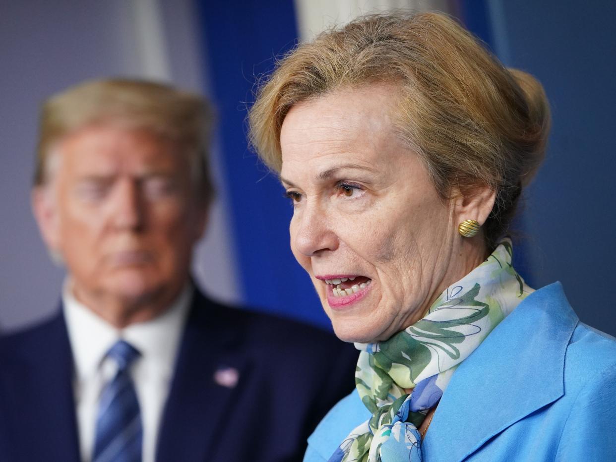 Deborah Birx speaks as Donald Trump listens during a briefing on COVID-19 on April 21, 2020.  (AFP via Getty Images)