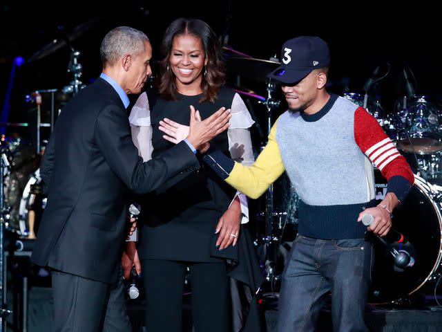 <p>Nuccio DiNuzzo/Chicago Tribune/Tribune News Service/Getty</p> Chance the Rapper, Barack Obama and Michelle Obama, during a Community Event, part of the Obama Summit on November 1, 2017.