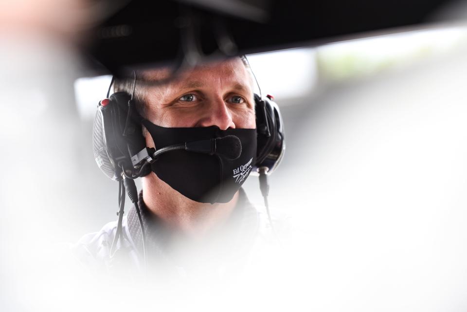 Ed Carpenter looks on from Rinus VeeKay's pit box during VeeKay's first win of his IndyCar career Saturday at IMS in the GMR Grand Prix.