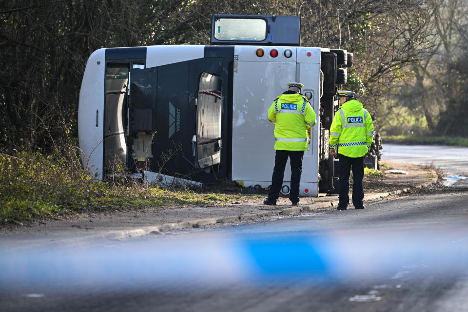 CANNINGTON, SOMERSET - JANUARY 17: Police wait while the bus is recovered, on January 17, 2023 near Cannington, Somerset, England. The bus was carrying workers at Hinkley Point C, the nuclear power station about 8 miles from the scene of the crash. (Photo by Finnbarr Webster/Getty Images)
