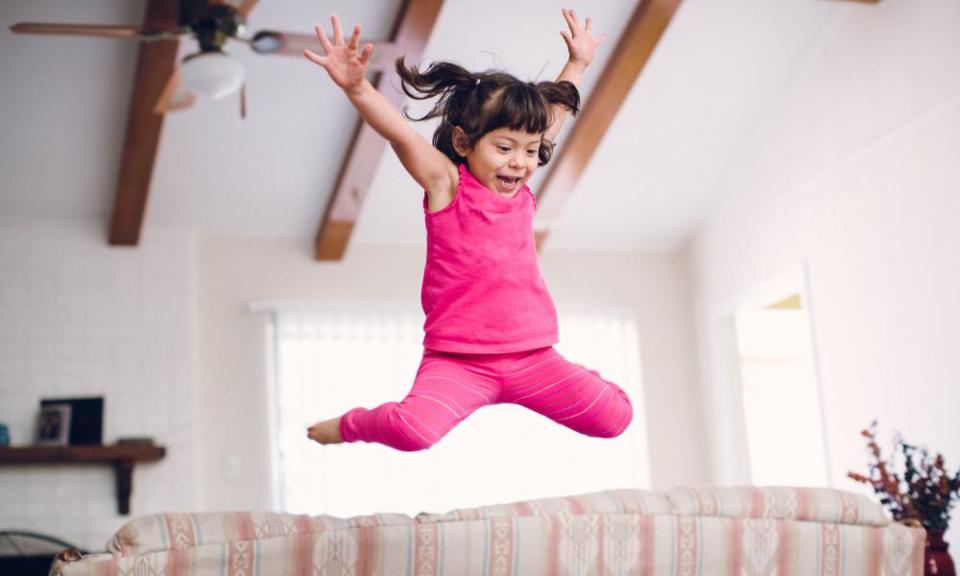 Toddler jumps off sofa