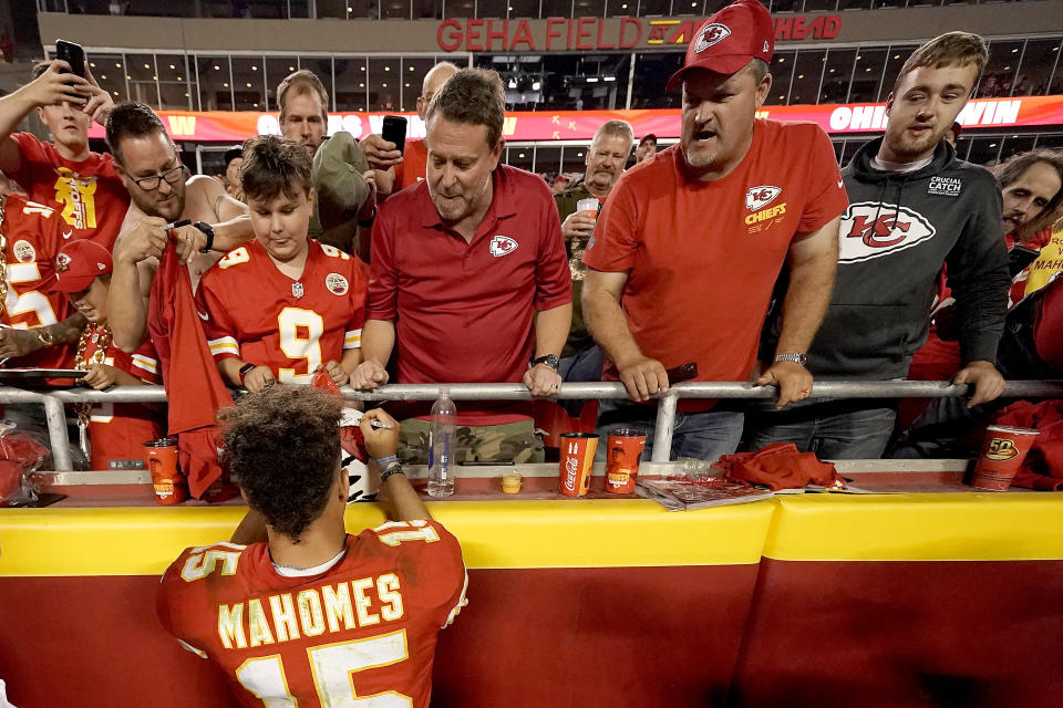 Kansas City Chiefs quarterback Patrick Mahomes signs autographs after an NFL football game against the Las Vegas Raiders Monday, Oct. 10, 2022, in Kansas City, Mo. The Chiefs won 30-29. (AP Photo/Charlie Riedel)