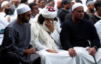 People react before Friday prayers at Hagley Park outside Al-Noor mosque in Christchurch, New Zealand March 22, 2019. REUTERS/Edgar Su