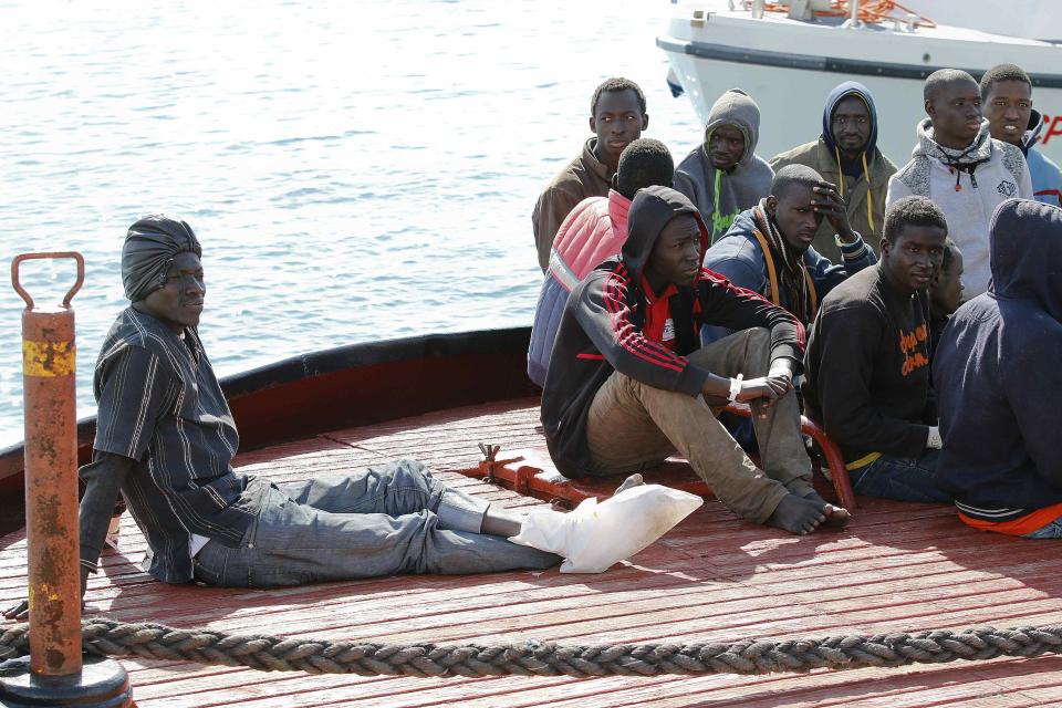 Migrants arrive by boat at the Sicilian harbour of Pozzallo